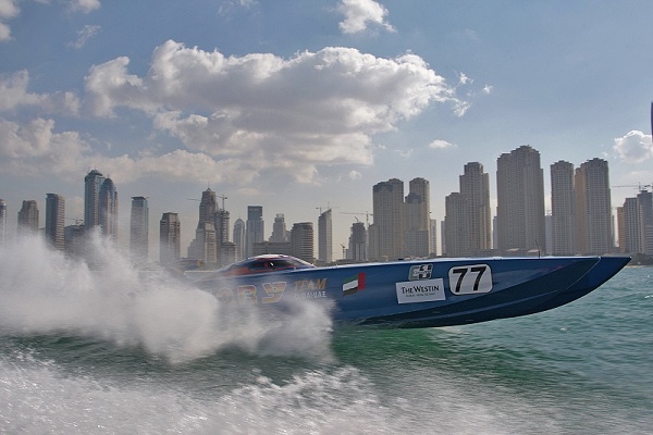 Yellow offshore catamaran at speed
