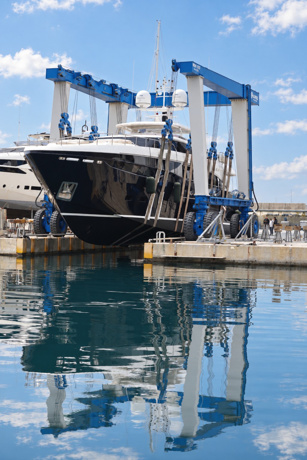 Luxury yacht in a shipyard on a bright sunny day